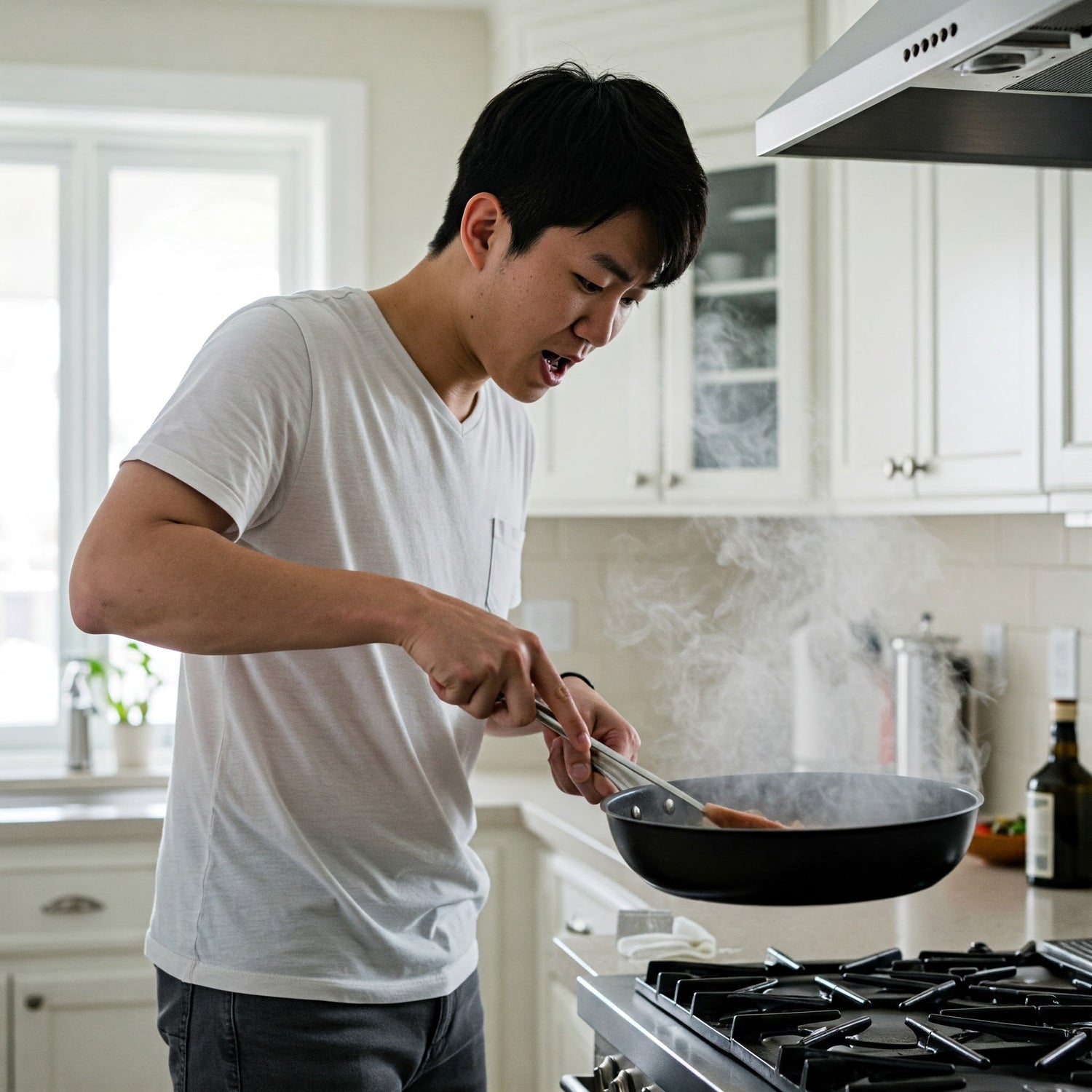 A man cooking food on a stove in a modern kitchen, surrounded by utensils and ingredients.